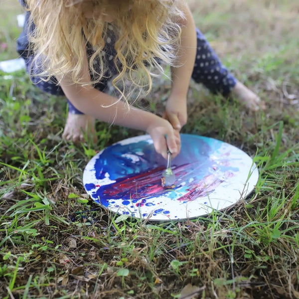 Kids creating canvas wall art you'll want to hang using acrylic paints