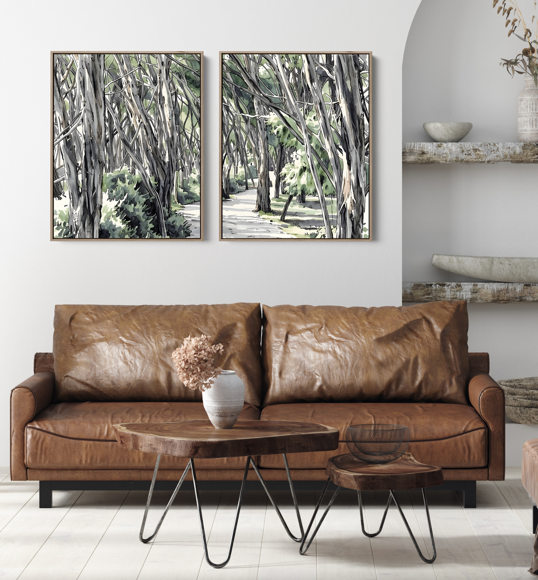 Brown leather sofa with wooden coffee and side tables beneath two piece australian eucalyptus native botanical wall art