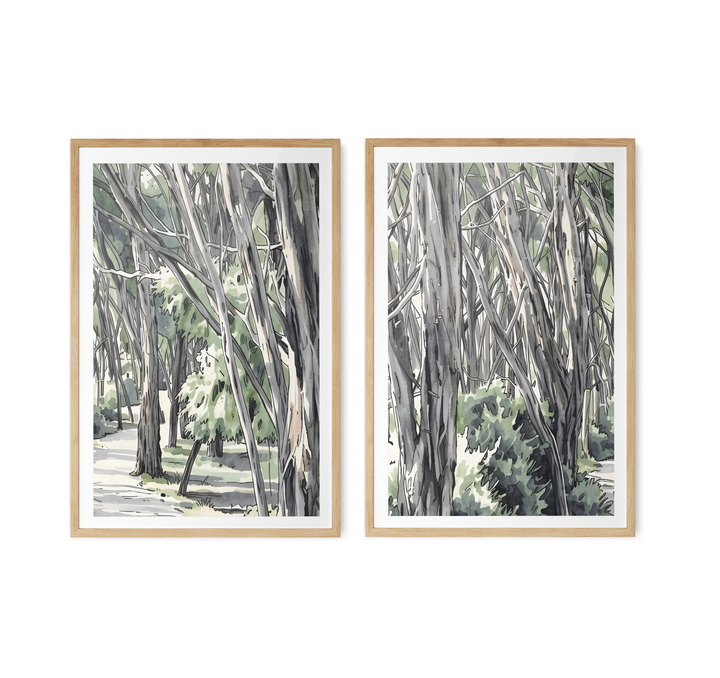 Two framed watercolor eucalyptus forest art prints with light wood frames and white matting for wall decor