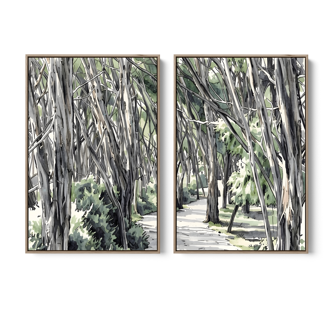 Two framed watercolor paintings of australian eucalyptus forest scenes in gray and green tones with light wood frames