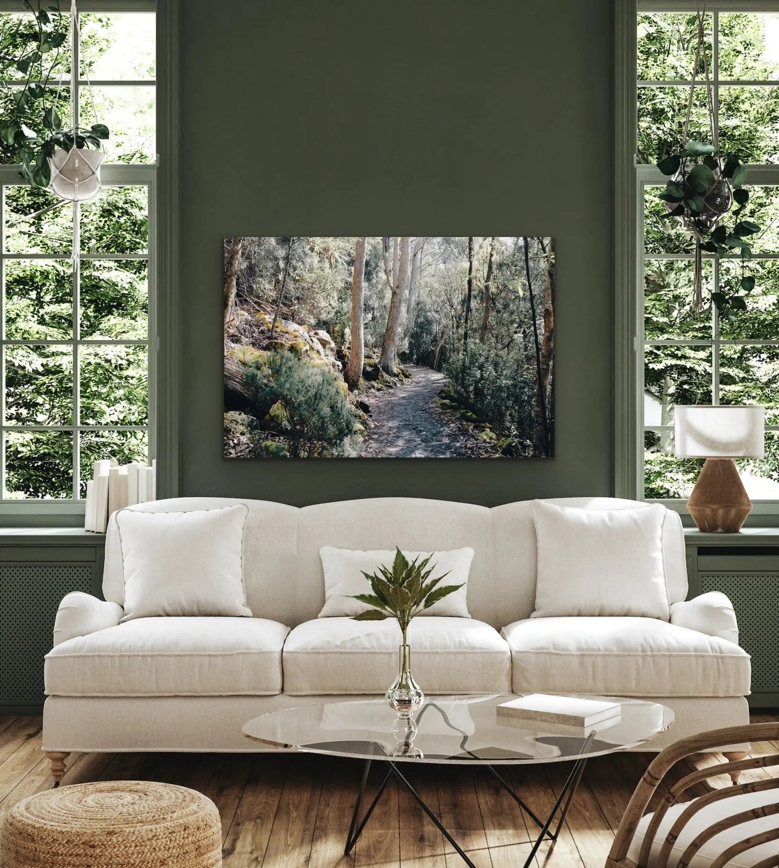 A rectangular photographic canvas print of a serene forest path on kunanyi mounted on a dark green wall
