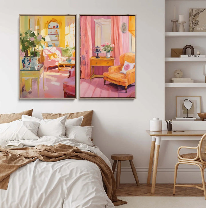 Two framed still life prints in warm pink and yellow tones hang above a bed for a cozy reading space
