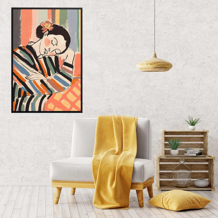 A framed fine art print titled a short nap by Treechild featuring a stylized woman with colorful vertical stripes and an orange flower in her hair against a textured wall
