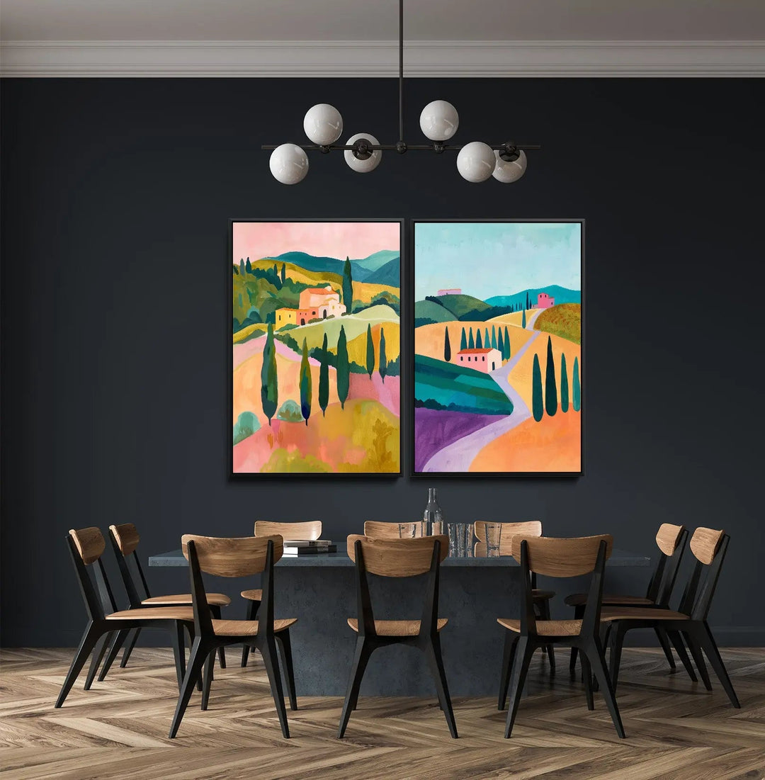 Two vibrant framed abstract landscape paintings with bold colors and stylized hills on a dark wall in tuscan dream artwork