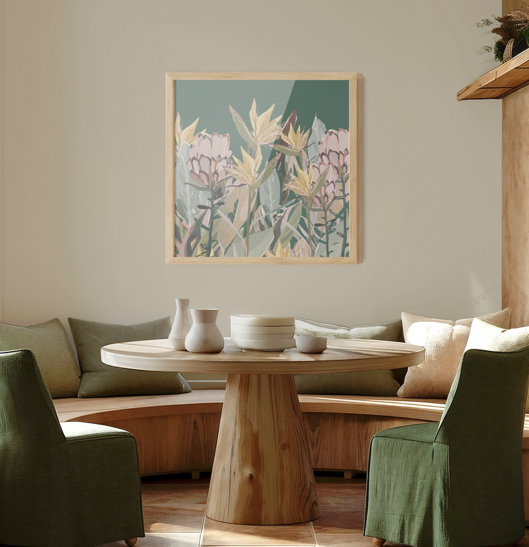A framed canvas print of Australian native plants with pink and yellow flowers on a muted teal background