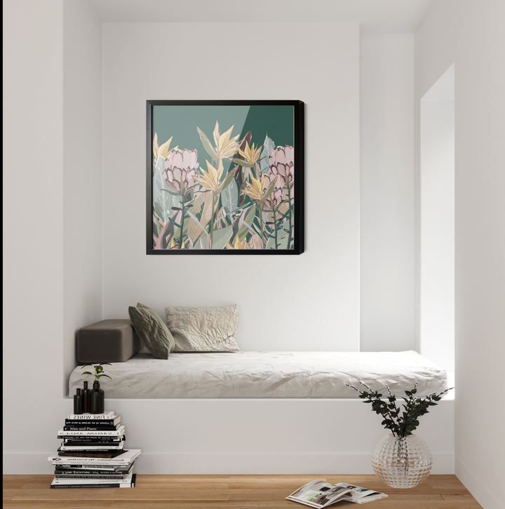 A framed canvas print featuring australian native pink and yellow flowers on a dark green background in a black frame