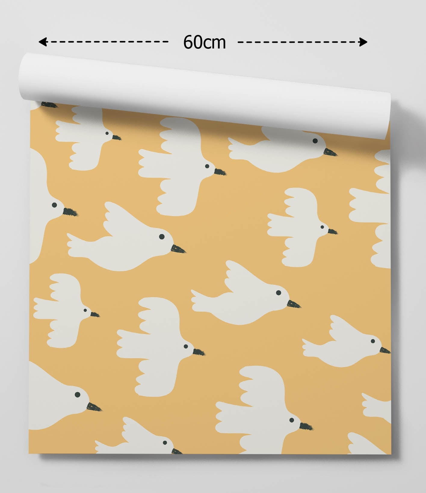A roll of peel and stick removable yellow wallpaper with a repeating pattern of white doves with black beaks and eyes