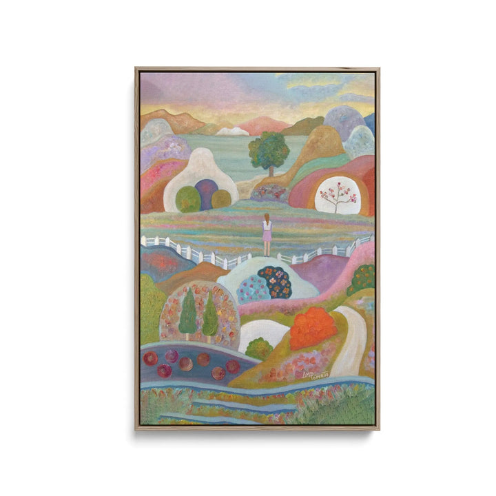 A framed fine art print of breaking out by Angeles M Pomata featuring a colorful abstract landscape with whimsical hills and a lone figure