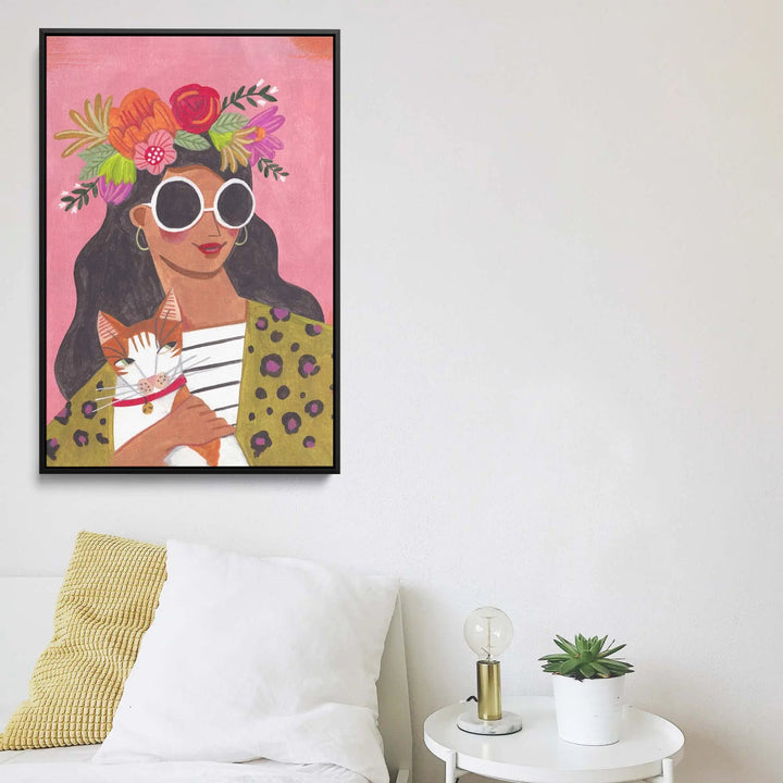 Cat lady by caroline bonne muller vibrant pink-framed canvas print of woman with white sunglasses holding orange-and-white cat