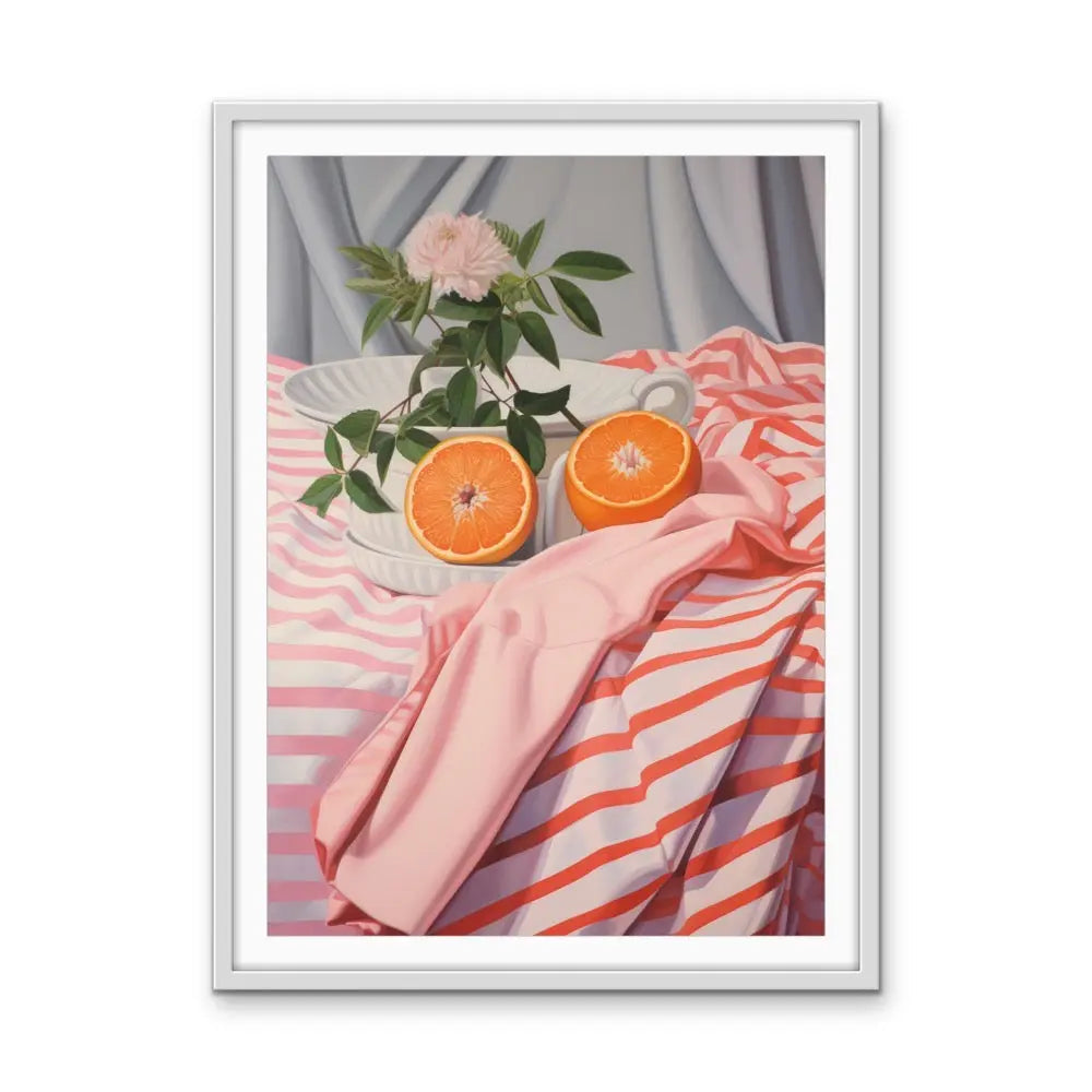 A framed still life painting titled Cut Orange with vibrant orange halves and a pink flower in a white ceramic bowl