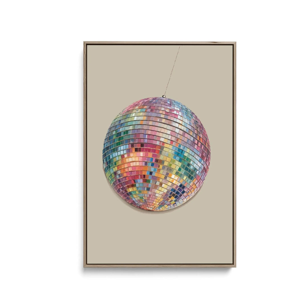 A vibrant multi-colored disco ball with reflective mirror tiles on a stretched canvas print or framed fine art print