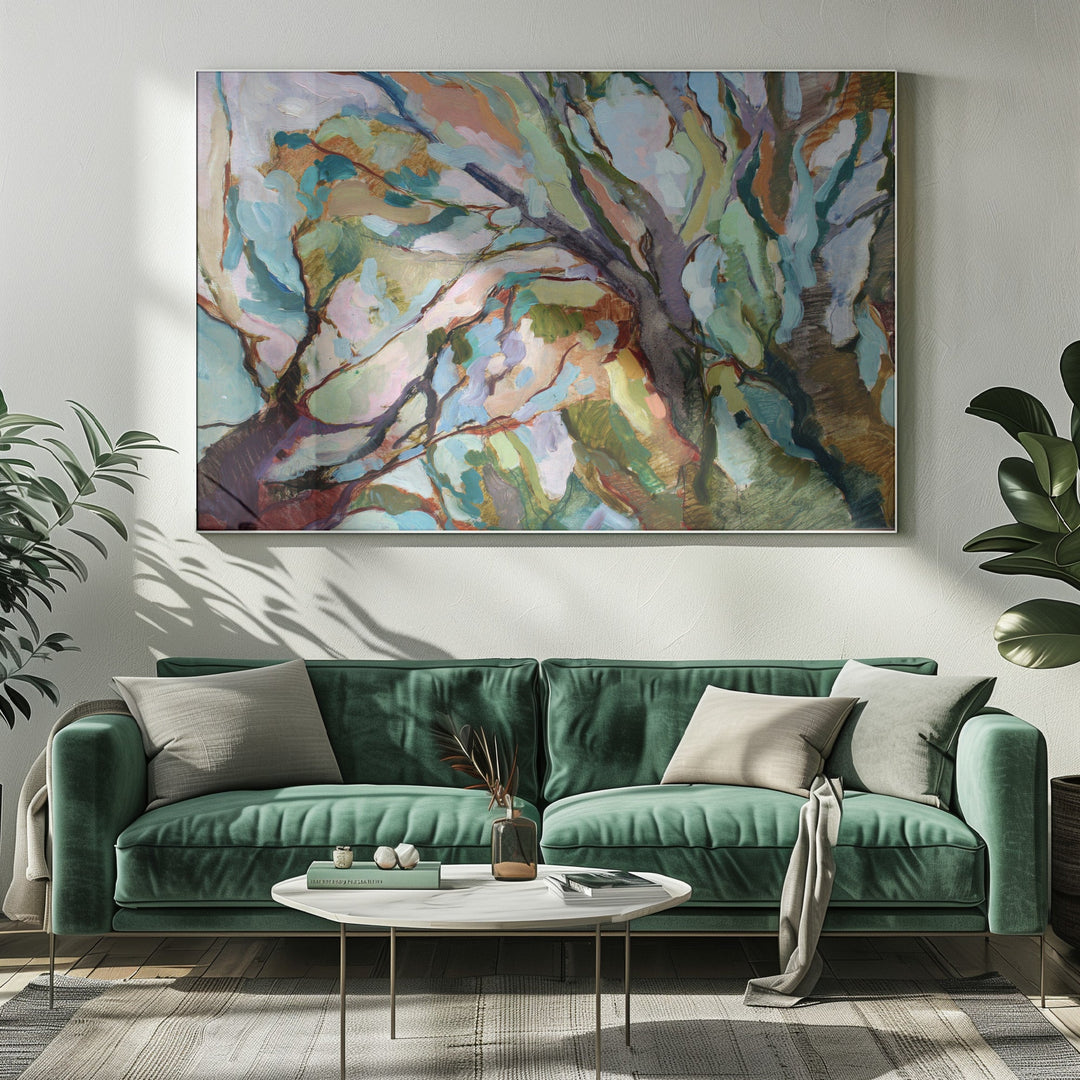 A vibrant abstract eucalypt forest painting in teal purple and earthy tones on stretched canvas above a green sofa