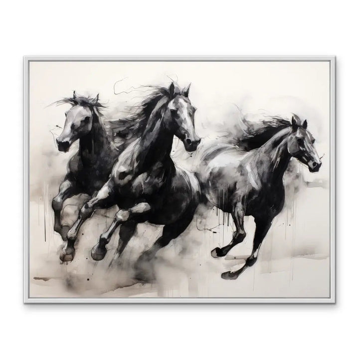 Black and white watercolor painting of three galloping horses in a silver frame on a stretched canvas print