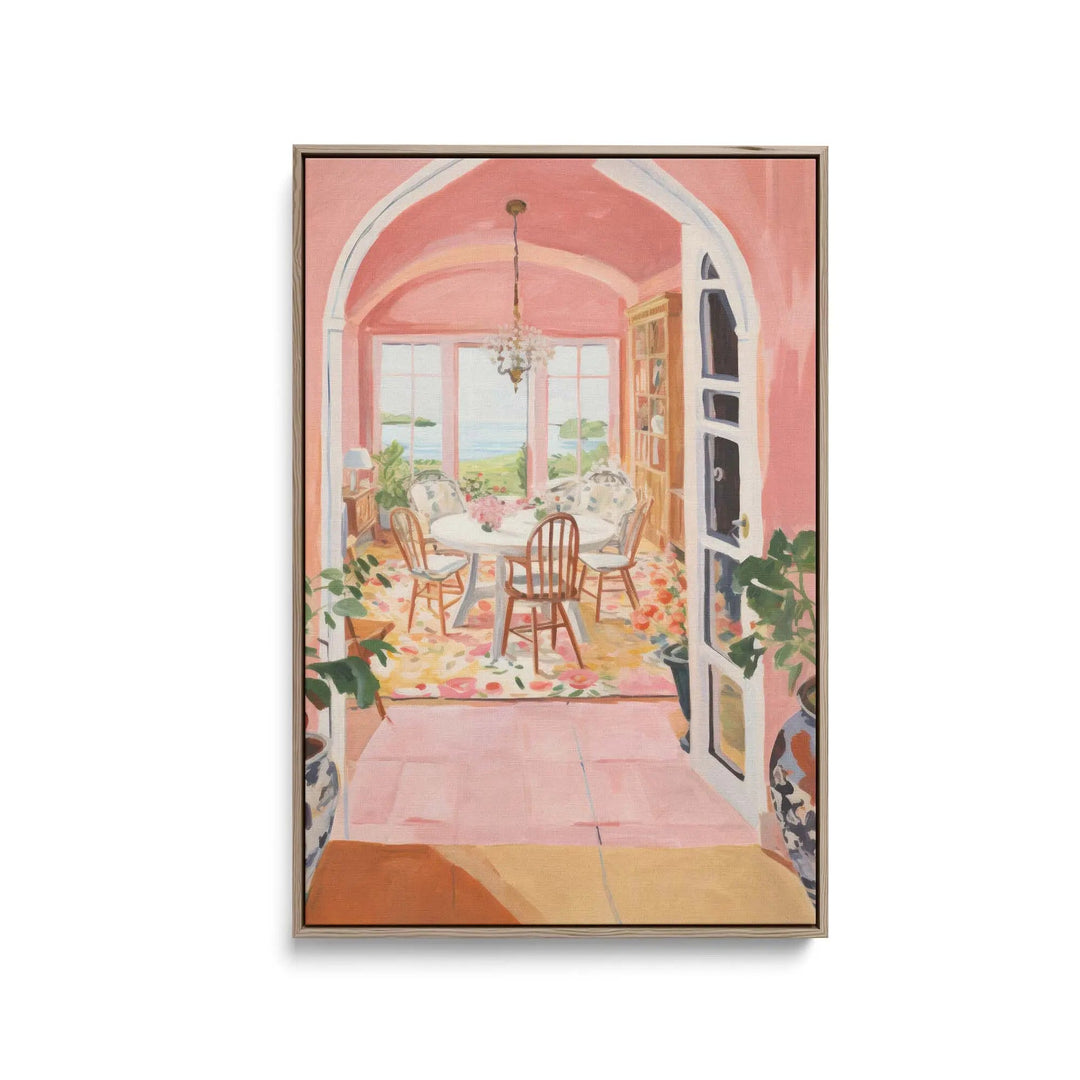 A framed watercolor print titled Hazy Memories depicting a cozy pink dining room with arched doorways and floral accents