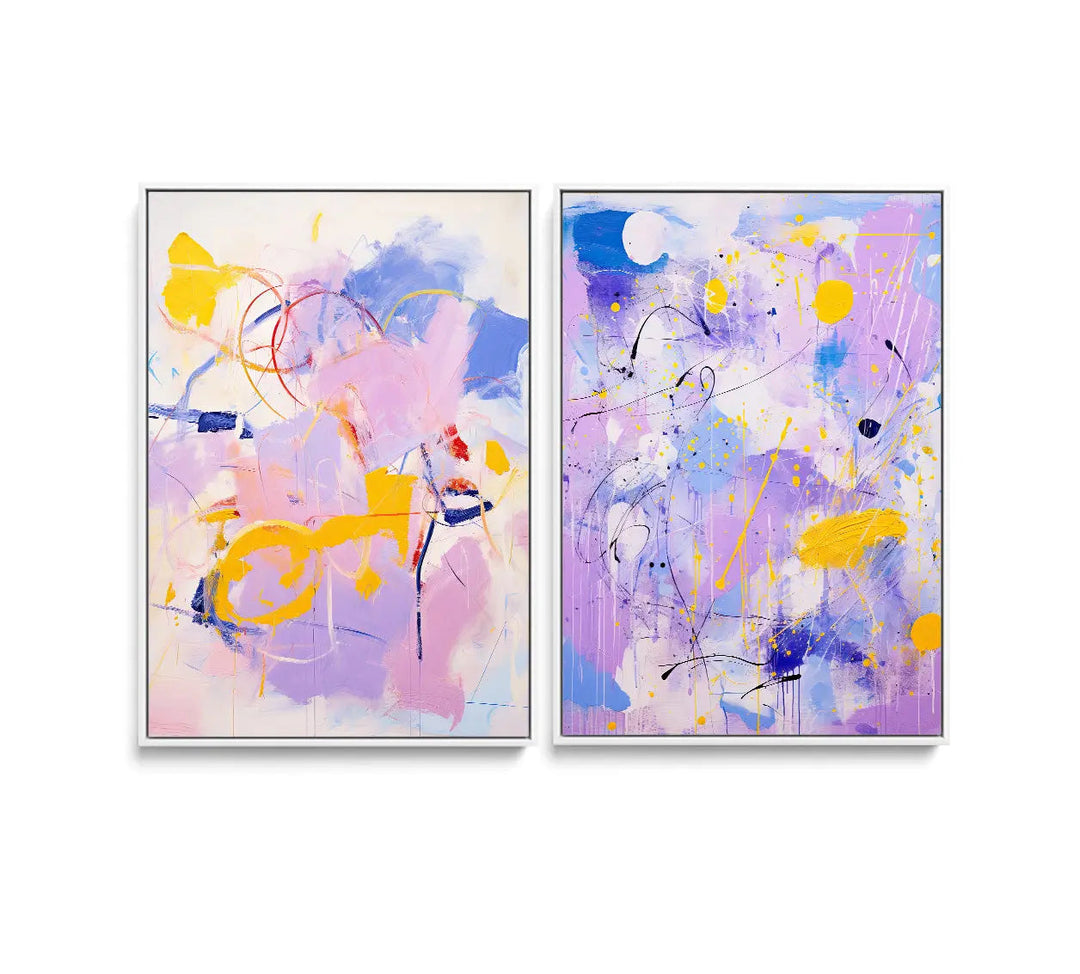 Two abstract paintings with vibrant purple yellow blue and pink splashes on canvas in white frames lilac dreams set