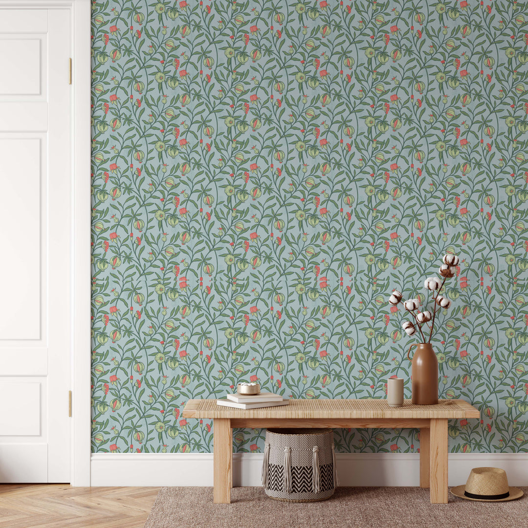 A tall matte brown ceramic vase holding cotton stems featured on little bud vintage floral peel and stick wallpaper