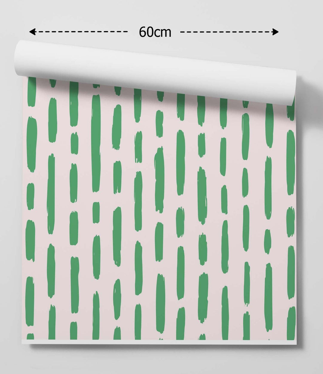 Roll of minty fresh green stripe peel and stick removable wallpaper with vertical green brushstrokes on soft pink background