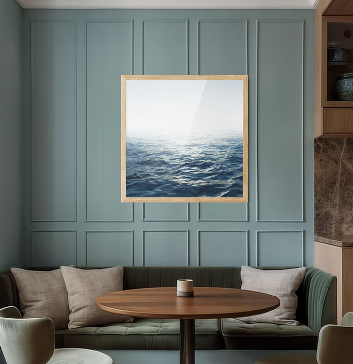 Square-framed moonlit ocean canvas print with deep blue textured waves and light wood frame for coastal decor