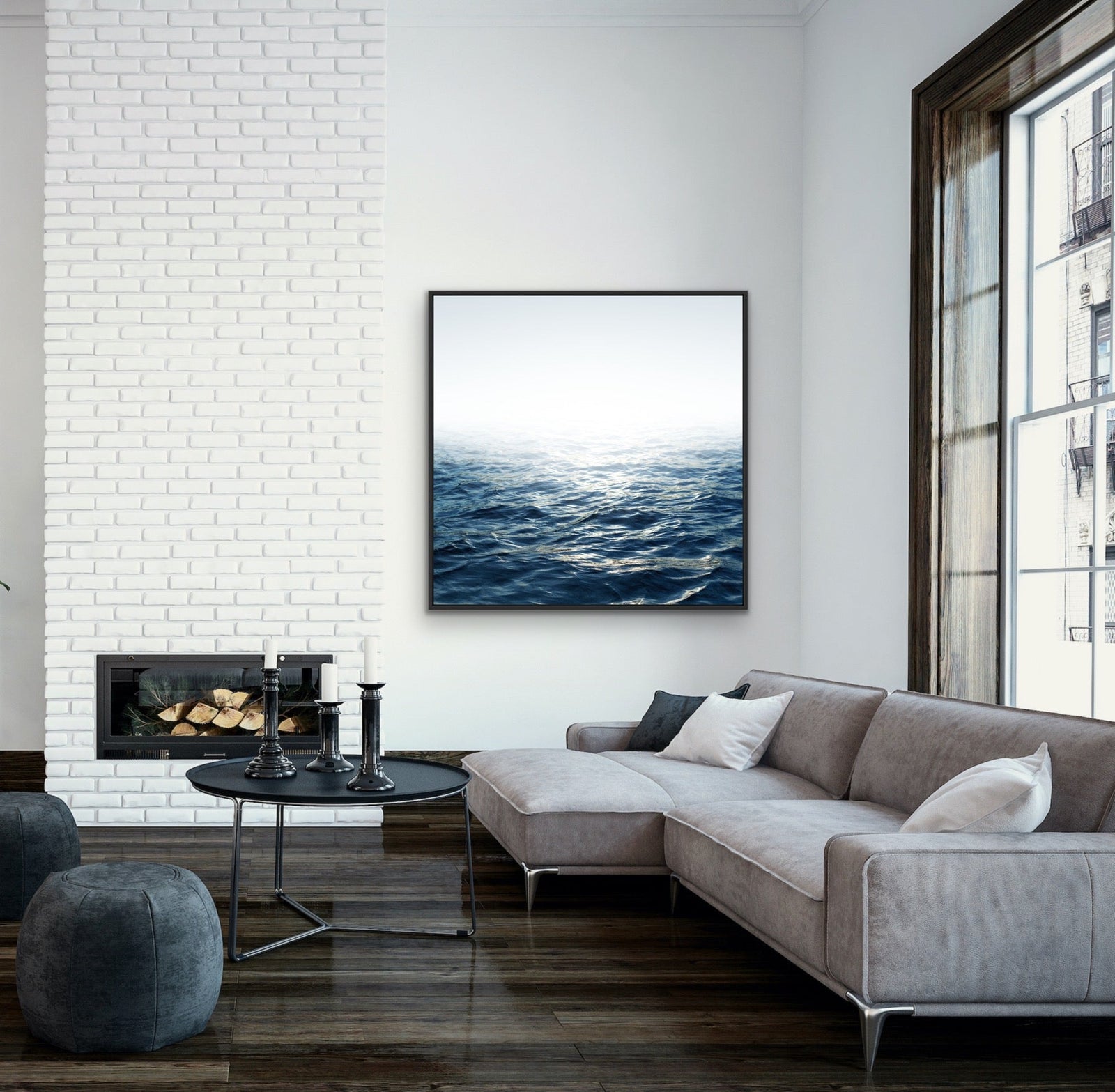 A framed canvas print of moonlit ocean with deep blue waves and soft white horizon in a sleek black frame
