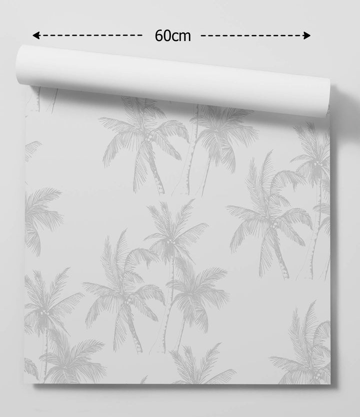 A roll of palm dreams peel and stick wallpaper in white and light grey with a subtle palm tree tropical pattern