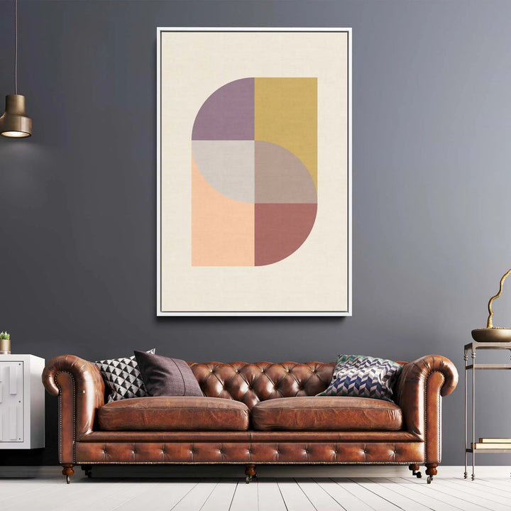 A framed peach 31 geometric stretched canvas print with pastel purple yellow peach and mauve overlapping curved shapes