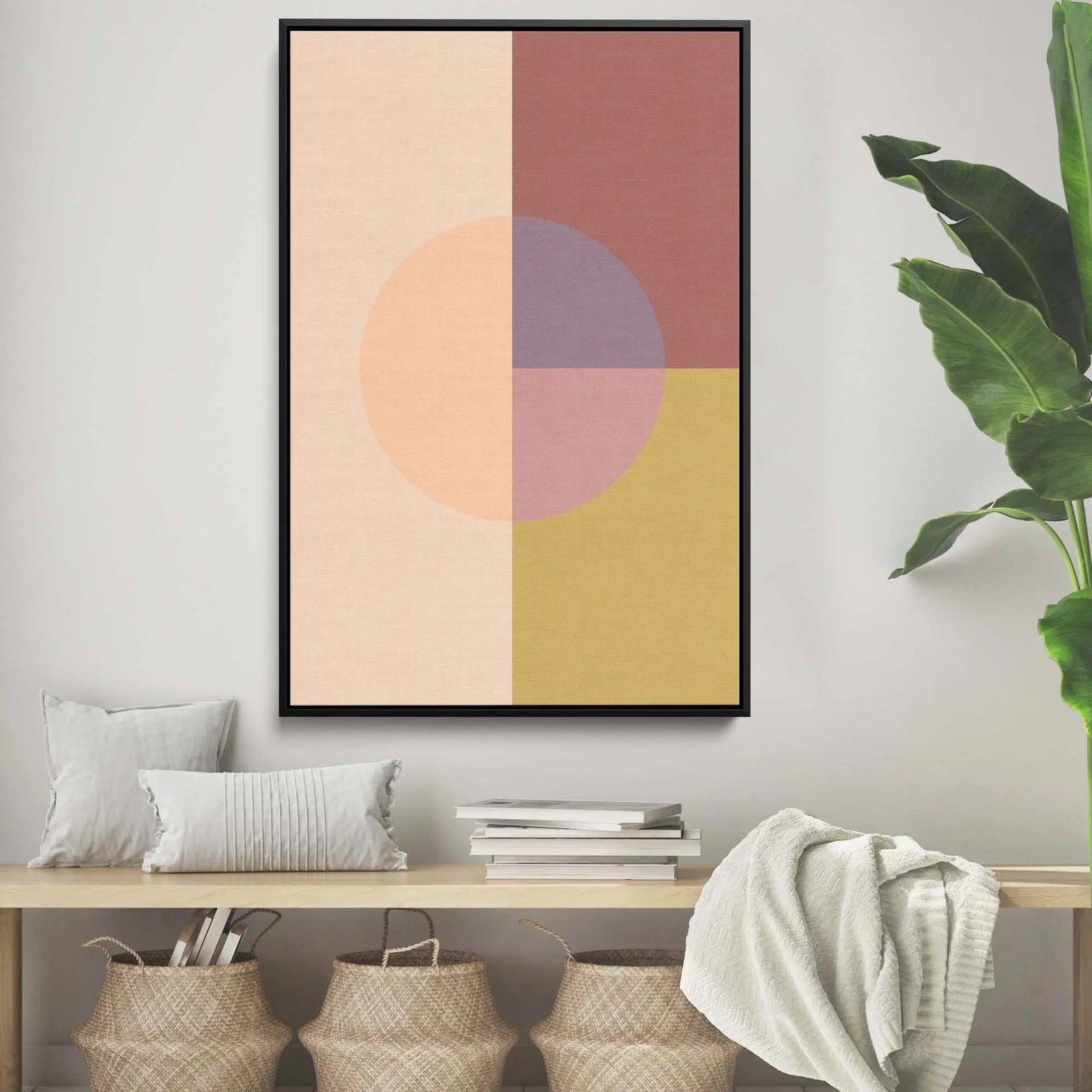 A modern abstract pastel geometric stretched canvas print with peach mauve and mustard yellow in a black frame