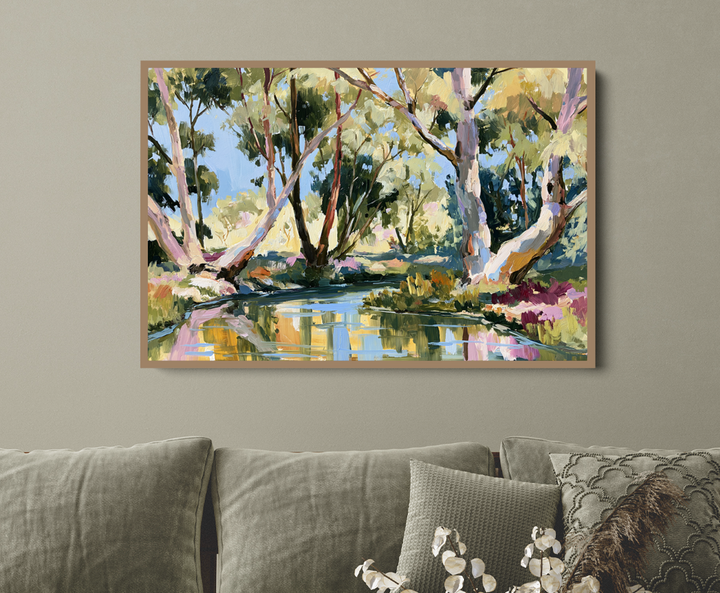 Living room with a gray sofa, wooden coffee table, and a large landscape painting on the wall.