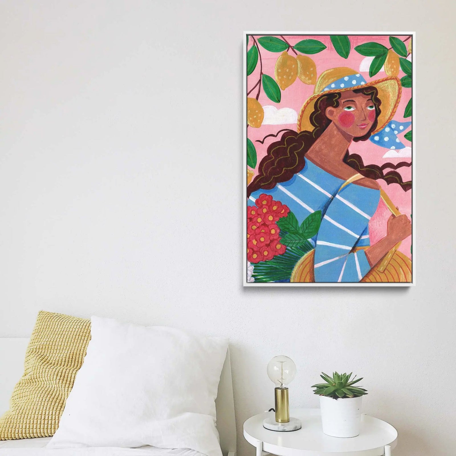 Vibrant stretched canvas print of a woman in a straw hat with lemons and flowers on pink background by Caroline Bonne Muller