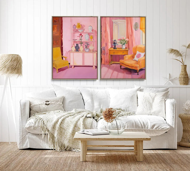 Two framed pastel pink and yellow interior prints hang above a white sofa in this home of ours print set