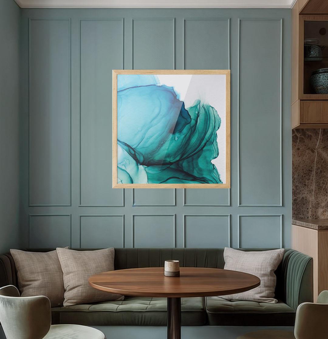 A square abstract alcohol ink wall art print with flowing teal and blue patterns in a light wood frame titled Unwind