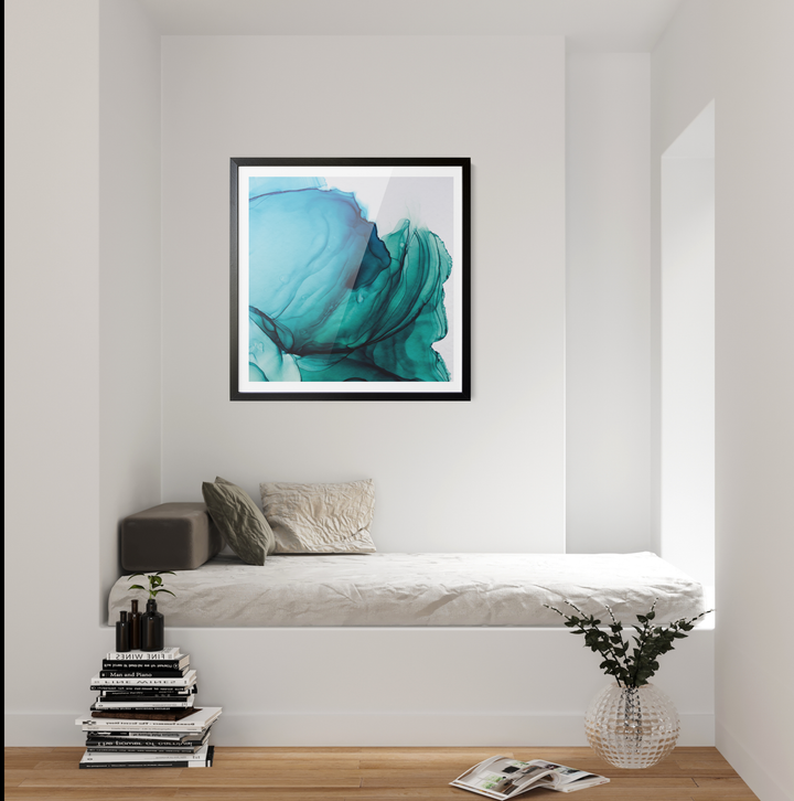 A framed abstract alcohol ink wall art print with swirling teal and blue patterns in a sleek black frame
