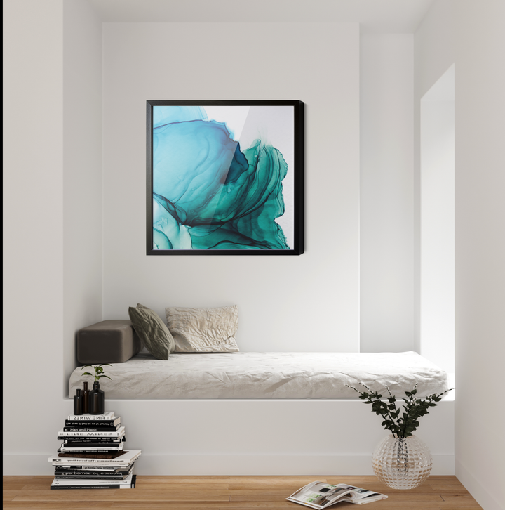 A framed abstract alcohol ink wall art print with swirling teal and blue patterns in a sleek black frame
