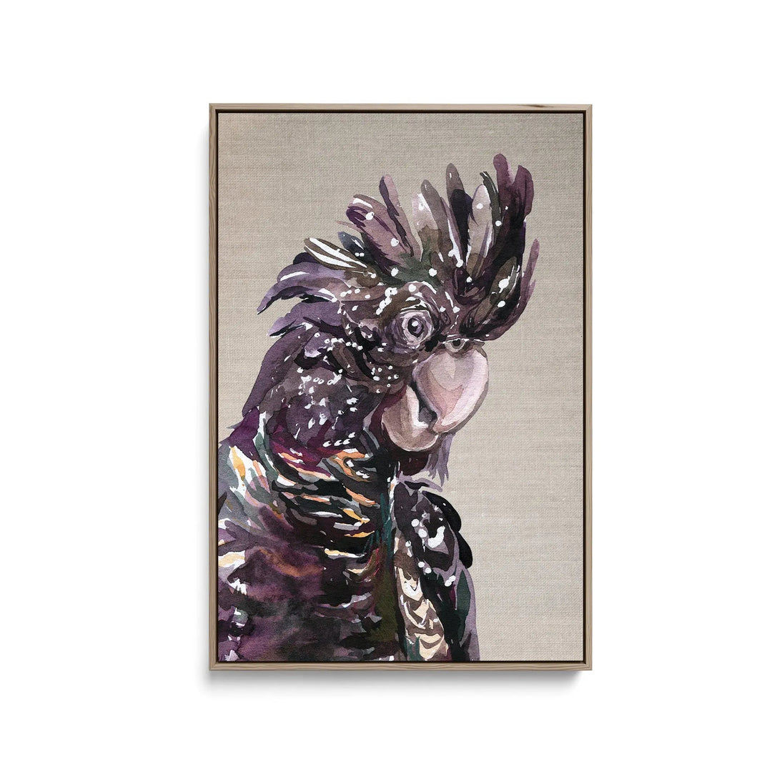 A framed stretched canvas print of a stylized black cockatoo with purple and green feathers on beige linen