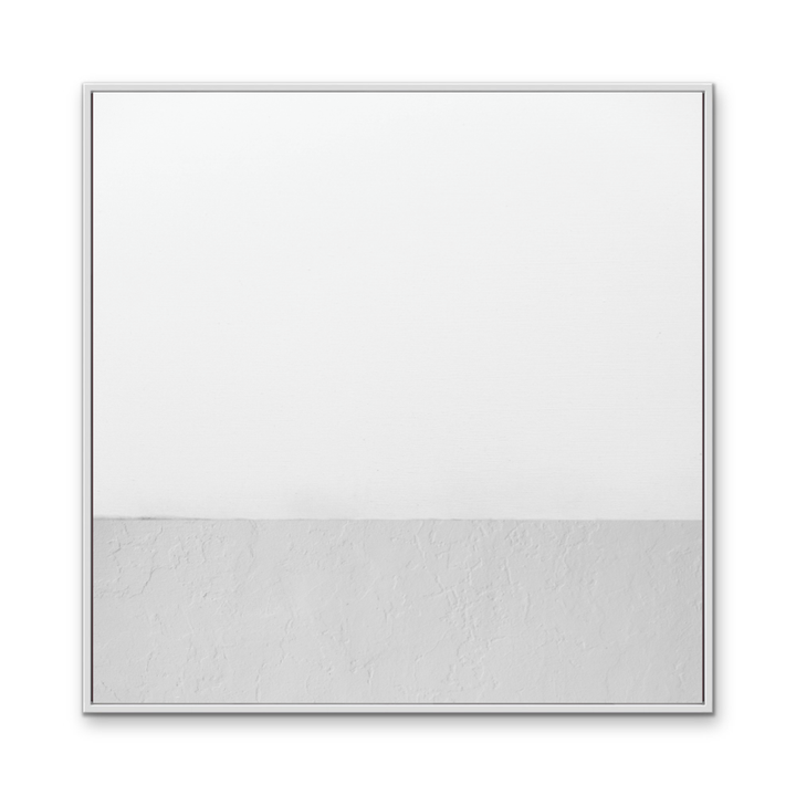 White whispers minimalist square abstract canvas print with white and textured gray halves in a silver frame