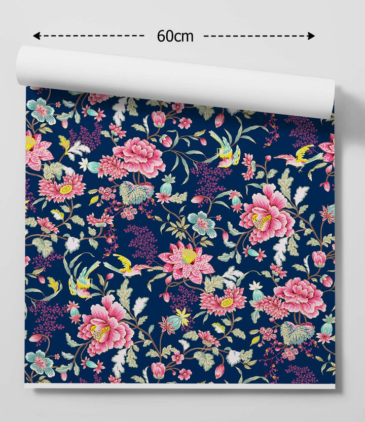 A roll of wild garden bold blue and pink asian inspired wallpaper with navy floral pattern and delicate birds