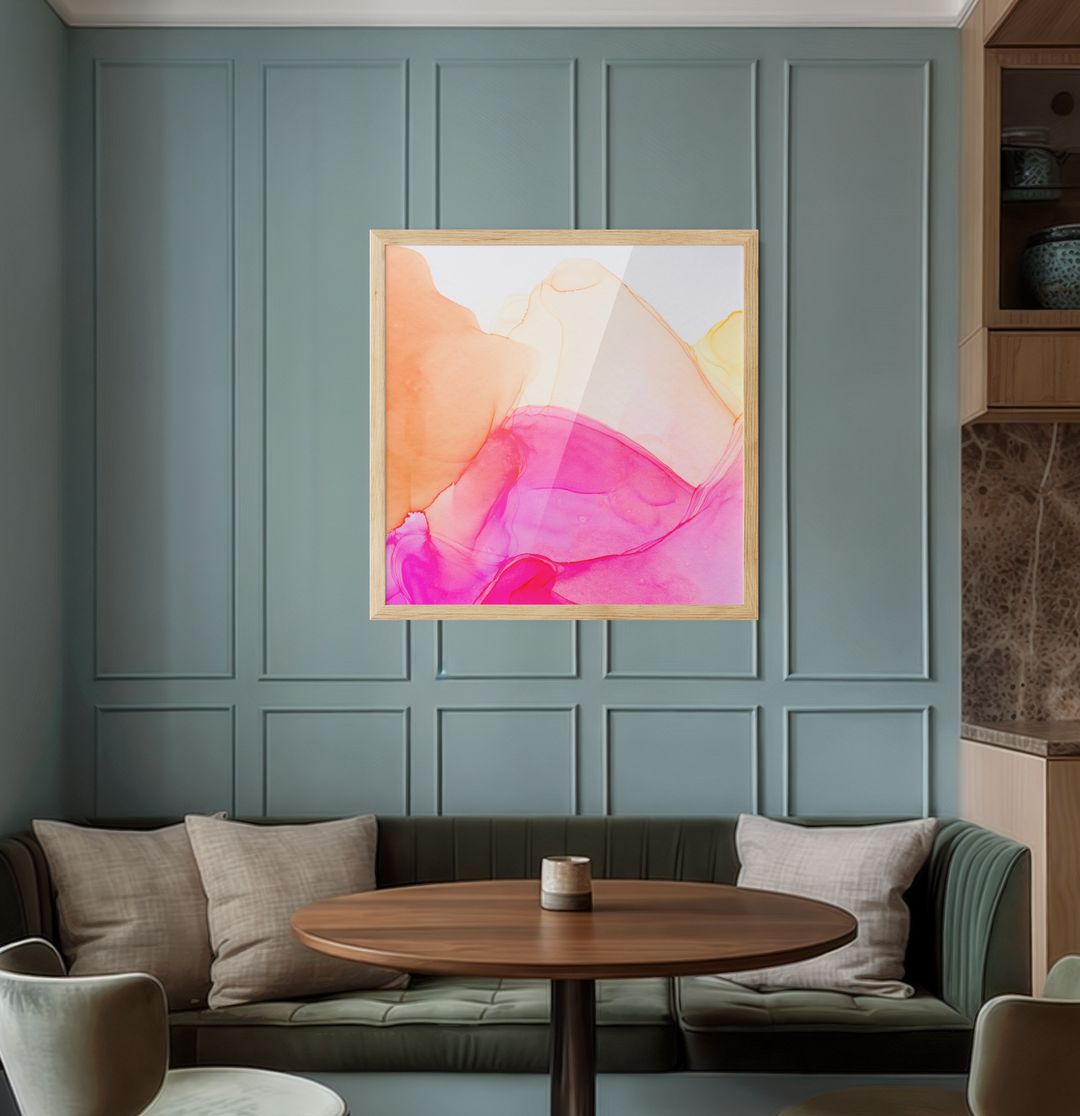 A vibrant abstract alcohol ink painting in pink orange and yellow hues in a minimalist wooden frame for wall art