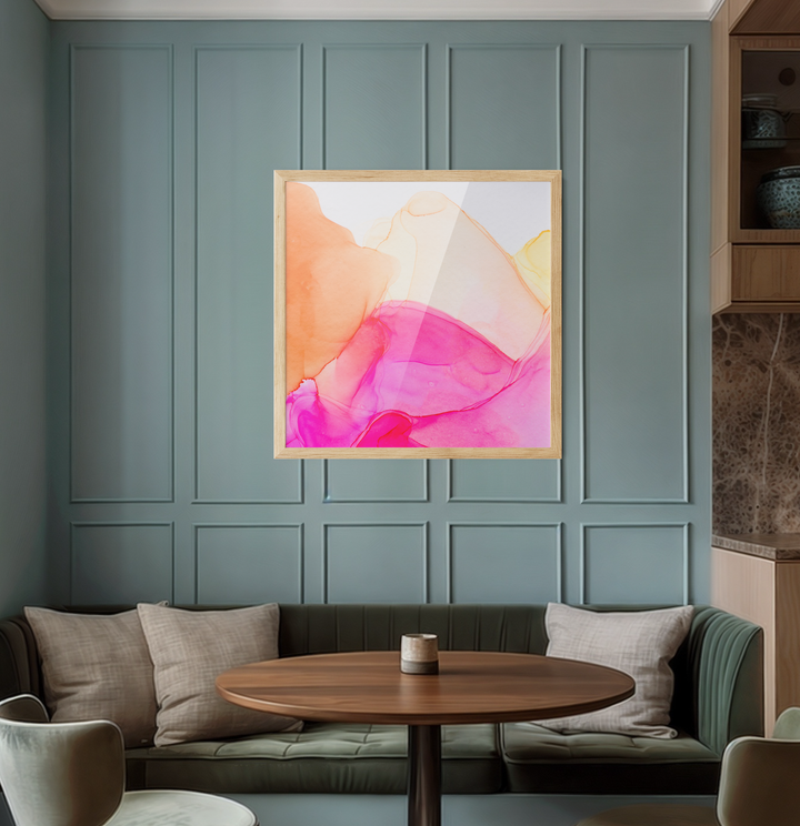 A vibrant abstract alcohol ink painting in pink orange and yellow hues in a minimalist wooden frame for wall art