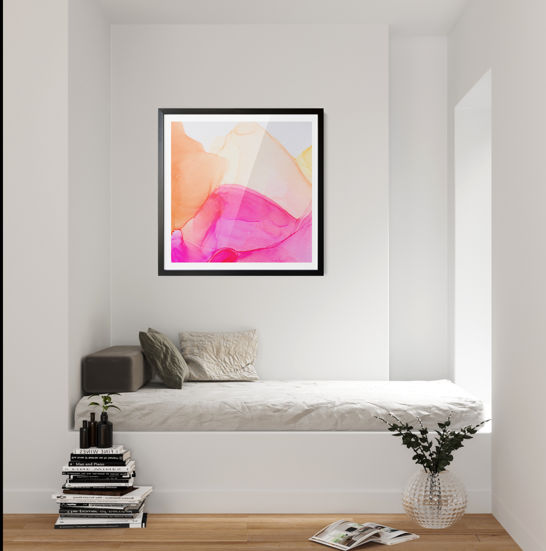 A framed abstract alcohol ink painting print with soft pink peach and yellow fluid shapes on white background